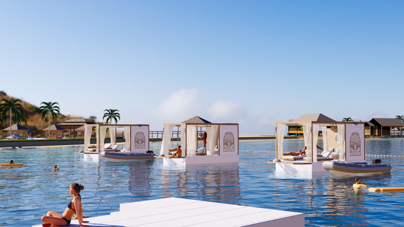 A group of Floating Lounges at a luxury beach club, with guests relaxing on the water surrounded by tropical views.